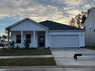 Street view A charming single-story home with a spacious garage in Watson Hill by Ashton Woods, Summerville, SC.