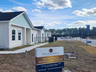 Modern model home with blue accents in Bellbrooke by Dream Finders Homes, waiting for new residents in Jacksonville, FL.