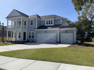 A charming two-story blue home with a double garage in Point Hope by Pulte Homes (Charleston, SC).