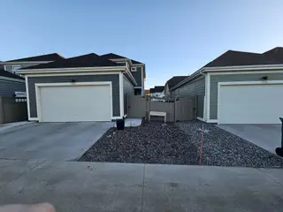 A modern duplex with dual garages and neat landscaping in Westerly by Brightland Homes (Erie, CO).