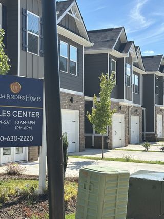 Charming townhomes with brick accents and clean lines in Azalea Hills by Dream Finders Homes (Temple, GA).