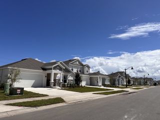 Beautiful new homes with pristine lawns and modern design in Preserve at LPGA by Lennar (Daytona Beach, FL).