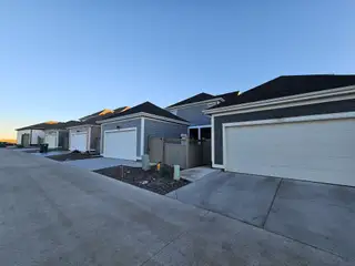 Chic modern homes with sleek, gray exteriors and spacious garages in Westerly by Brightland Homes (Erie, CO).