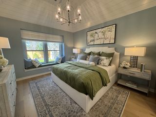 Another angle of the elegant bedroom with a vaulted ceiling, featuring soft lighting and a luxurious color palette.
