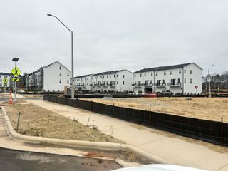 Contemporary townhomes with spacious balconies and pedestrian-friendly pathways in Twyla Walk by Stanley Martin Homes (Cary, NC).
