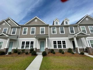 Beautiful townhomes with charming facades in North Creek at Nexton by True Homes, Summerville, SC.
