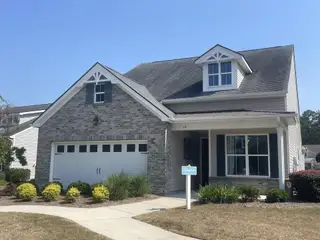 A charming brick home with classic design in Four Seasons at Lakes of Cane Bay by K. Hovnanian® Homes (Summerville, SC).