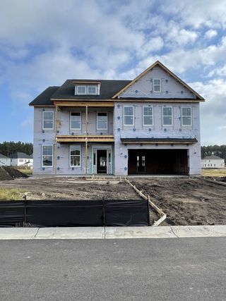 A charming under-construction home in Lochton by Mungo Homes, Summerville, SC, showcasing a spacious future family abode.