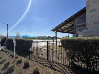 Community Amenities A modern pavilion and pool area in Crosswinds by Milestone Community Builders, nestled in the scenic surroundings of Kyle, TX.