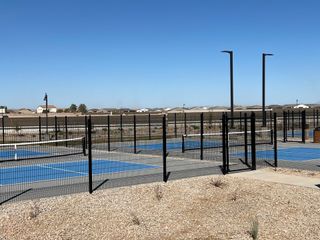 Modern tennis courts in Rancho Mirage Signature Series by Meritage Homes, offering vibrant outdoor amenities in Maricopa, AZ.