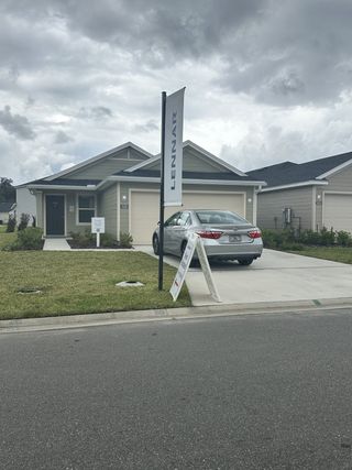 Contemporary home with a manicured lawn in Kings Landing by Lennar (Jacksonville, FL).