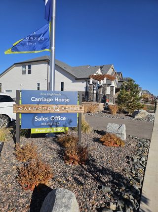 Modern sales office for Erie Highlands by Oakwood Homes Co, featuring landscaped grounds and contemporary design in Erie, CO.