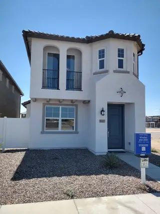 Street view A charming two-story home with arched windows in Hawes Crossing: Discovery by Lennar (Mesa, AZ).
