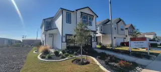 Stylish modern home with black trim and landscaped garden in Talley Fields - The View Series by View Homes (San Antonio, TX).