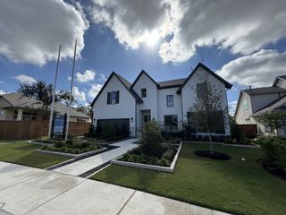 Street view A beautiful modern home with manicured landscaping in Parmer Ranch - 60' by Westin Homes (Georgetown, TX).