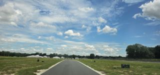 A picturesque view of spacious fields and clear skies in Millwood: Millwood Estates - The Enclave by Lennar (Ocala, FL).