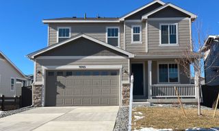 A modern two-story home with a sleek design in Settler's Crossing by Richmond American Homes (Commerce City, CO).