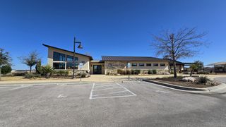 A modern community center with sleek design at Saddle Creek by Pacesetter Homes in Georgetown, TX.