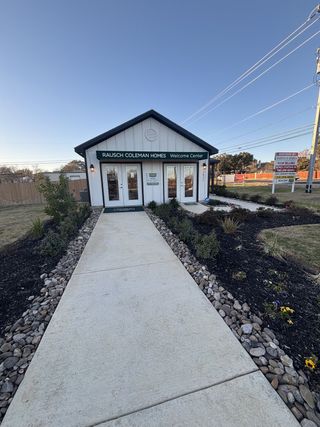 Charming welcome center with a tidy walkway at Hidden Oasis by Lennar in San Antonio, TX.