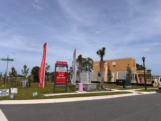 Street view New homes under construction at Harvest at Ovation, featuring Taylor Morrison's quality builds in a scenic Winter Garden location.