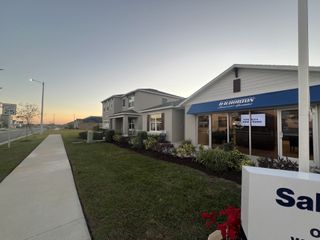 A modern home with manicured landscaping in Eden Hills by D.R. Horton (Lake Alfred, FL).
