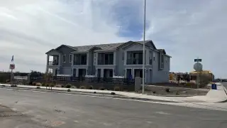 Modern gray townhomes with balconies in Hawes Crossing: Towns by Lennar, Mesa, AZ.
