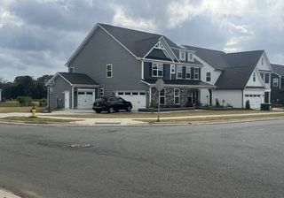 Street view A charming gray home with modern features and spacious layout in Harmony by Eastwood Homes (Harrisburg, NC).