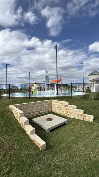 A vibrant community splash pad in Santa Rita Ranch: 40-45ft. lots by Highland Homes, Liberty Hill, TX.