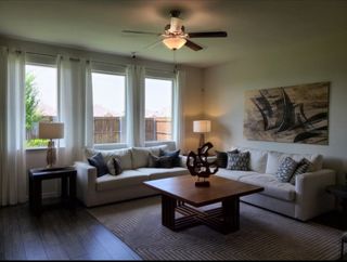 A modern living room with plush sofas, abstract wall art, and sleek wooden accents, creating a cozy ambiance.