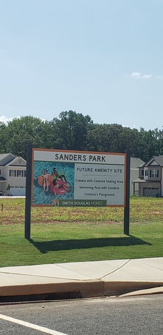 Street view Future amenity site in Sanders Park by Smith Douglas Homes, Austell, GA, promising pool, cabana, and playground.