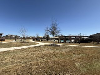 Community Amenities Beautiful outdoor paths and play areas at Davis Ranch by Pulte Homes (San Antonio, TX), perfect for family walks and recreation.