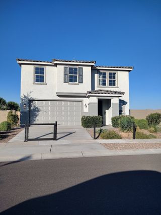 A modern two-story home with sleek gray shutters in Dobbins Manor Classics by KB Home (Phoenix, AZ).