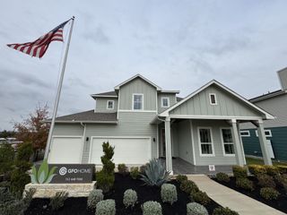 Street view A beautiful two-story home with a well-kept garden in Whisper Valley by GFO Home (Manor, TX).