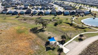 Community Amenities A scenic community with charming homes overlooking lush green spaces in The Colony- Pine Cove by Sitterle Homes (Bastrop, TX).