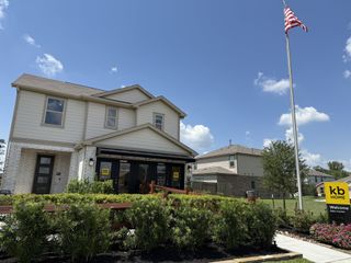 A charming home with landscaped greenery in Glendale Lakes North by KB Home (Arcola, TX).