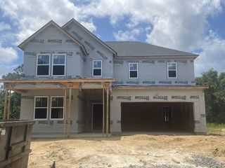 A spacious two-story home under construction in Limehouse Farms: Arbor Collection by Lennar (Summerville, SC).