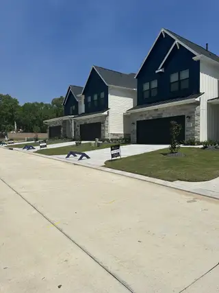 Modern homes with dark accents and landscaped yards in Summer Place 35' by Tricoast Homes (Montgomery, TX).