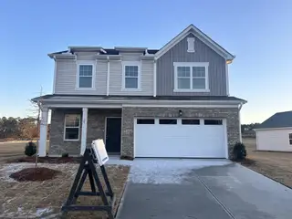 A charming two-story home with a spacious garage in Green Hill by Starlight Homes (Louisburg, NC).