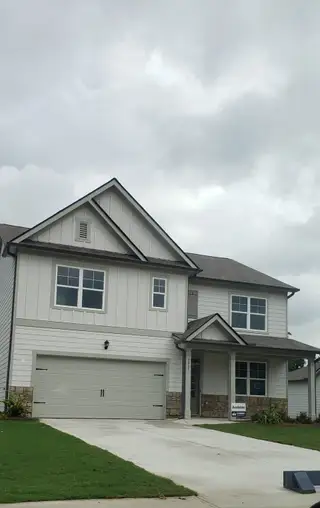 A charming modern home with a sleek facade and landscaped yard in Fairhaven by D.R. Horton (Lithia Springs, GA).