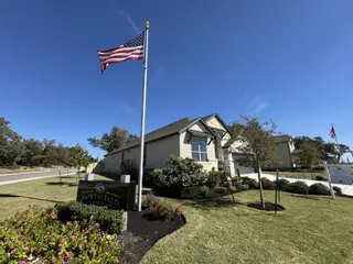 A charming home with lush landscaping in Highland Village by Monticello Homes, Georgetown, TX.