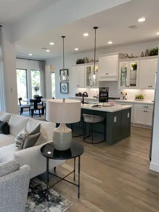 A bright and airy living space seamlessly connecting the kitchen, dining, and family areas.