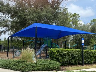 Community Amenities A vibrant community playground with shade in Kettering at eTown - Traditional Collection by David Weekley Homes (Jacksonville, FL).