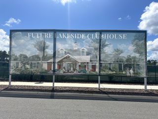 Future lakeside clubhouse in Reverie at Palm Coast by Dream Finders Homes, showcasing modern design and lush landscaping (Palm Coast, FL).