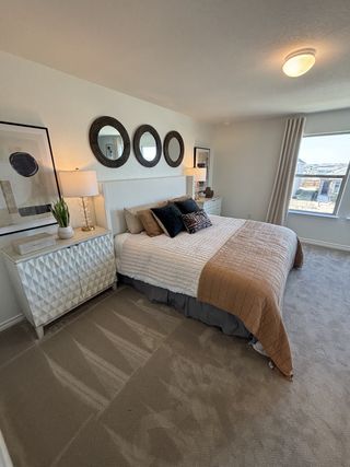 A cozy bedroom with textured accents, stylish mirrors, and soft furnishings creates a serene and inviting atmosphere.