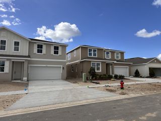 Elegant two-story homes with spacious garages in Seasons at The Grove by Richmond American Homes (Mascotte, FL).