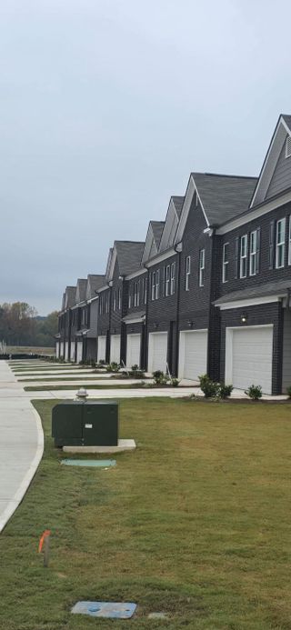 Elegant townhomes with modern design in Reeves Park by Rockhaven Homes, located in Stockbridge, GA.
