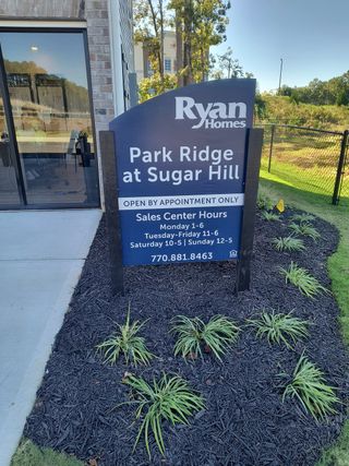 Street view Welcome to Park Ridge at Sugar Hill by Ryan Homes, nestled in scenic Sugar Hill, GA.