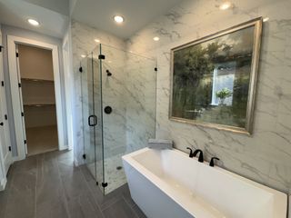 Model Home A stylish master bath with a spacious shower, a soaking tub, and modern fixtures creating a spa-like feel.