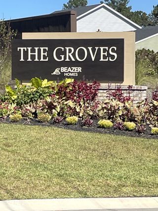 A welcoming entrance sign with lush landscaping at The Groves of Berkeley by Beazer Homes (Moncks Corner, SC).