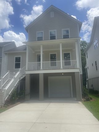A charming multi-story home with a welcoming porch in Indigo Grove Single Family Homes by Stanley Martin Homes (Johns Island, SC).
